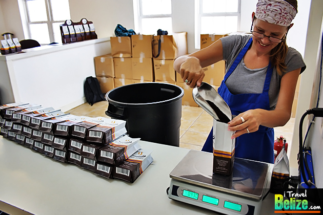 Marci weighs the ground coffee for the 1/2 pound packages